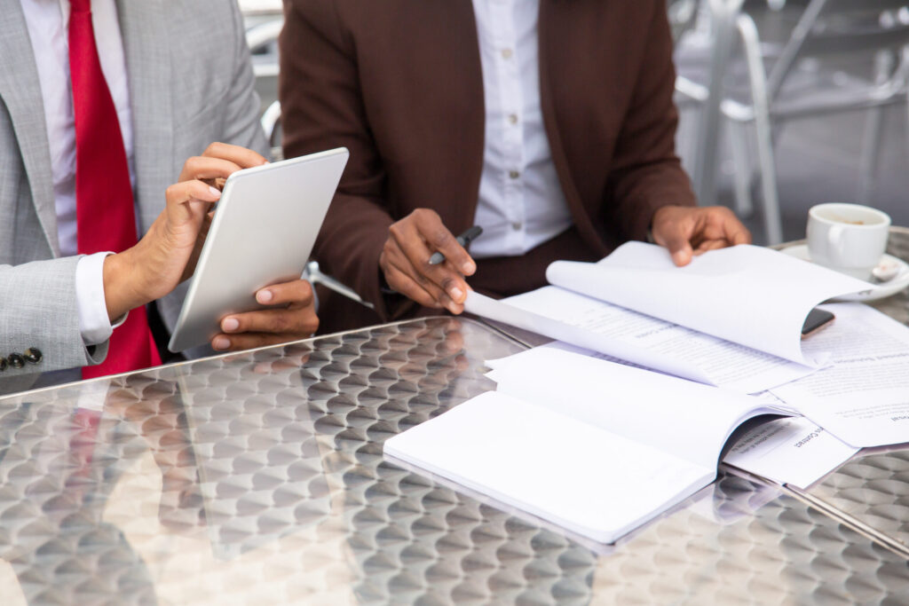Two businesspeople reviewing documents together