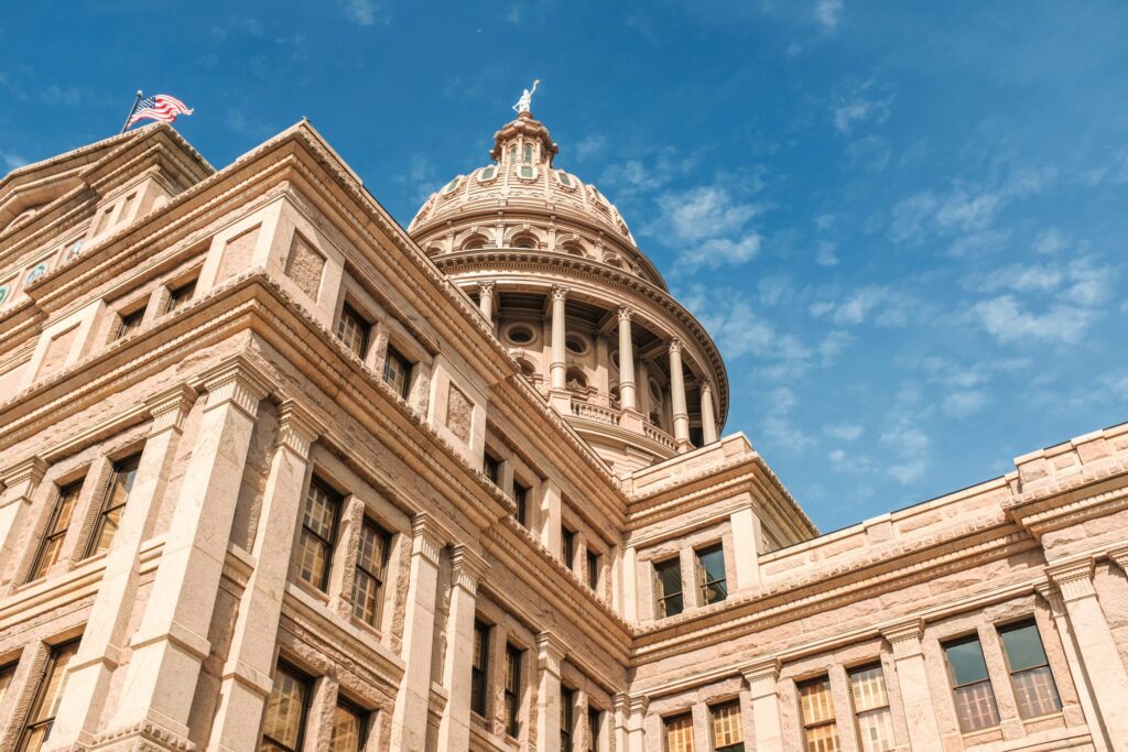 Texas Capitol building against a blue sky in Austin