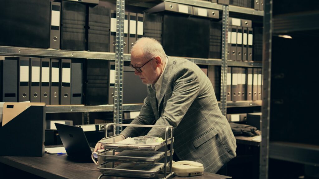 Investigator reviewing a report with classified data