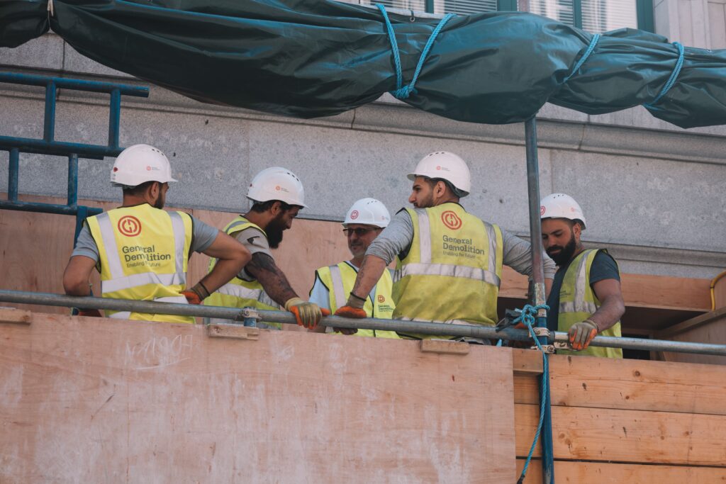 A crew of subcontractors on a federal construction site, the firms a Miller Act payment bond is meant to protect.