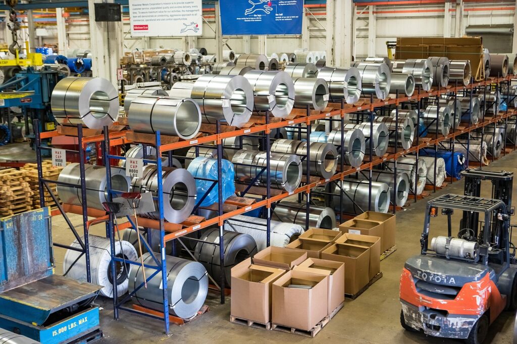 Forklifts and packed crates in a warehouse, ready to ship a DLA order