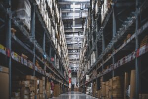 Warehouse shelves stocked with parts and supplies bought through DLA DIBBS