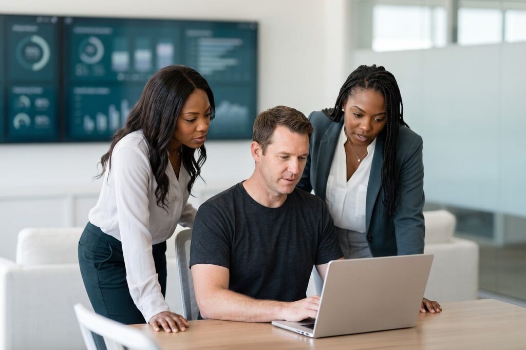 Small business team reviewing 8(a) program eligibility requirements on a laptop