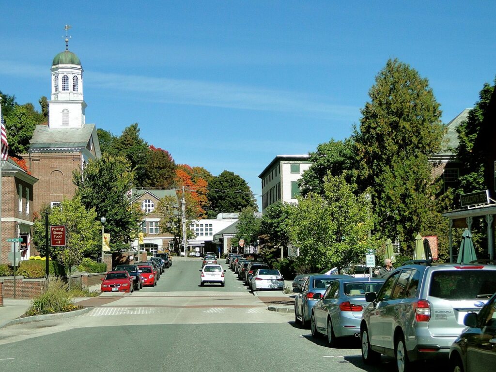 Small-town main street with shops and a church steeple, the kind of community HUBZone certification is meant to support
