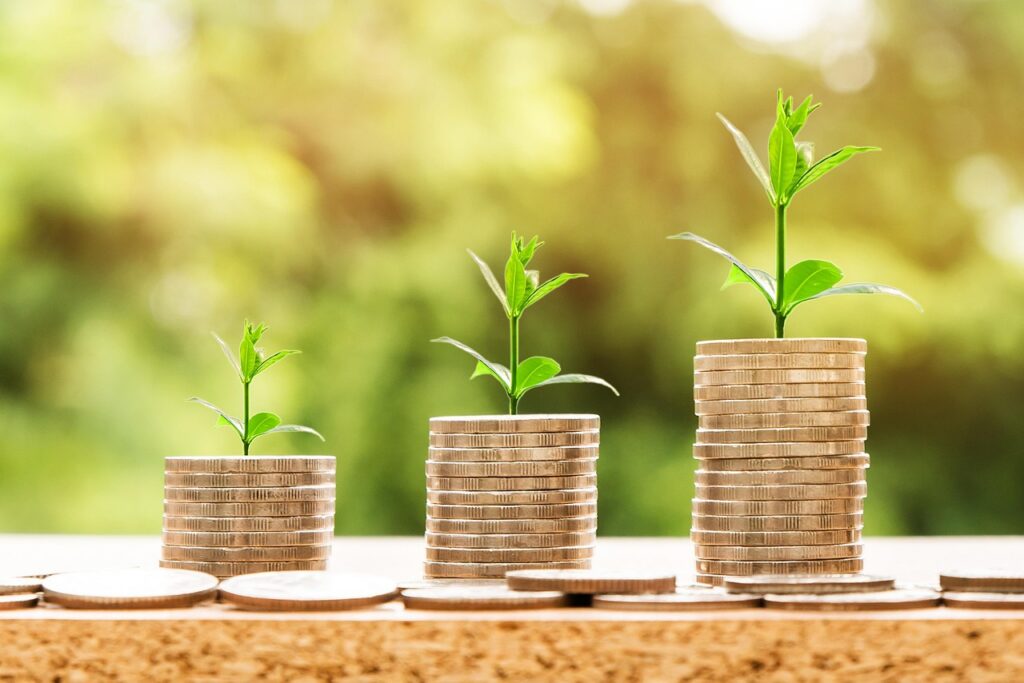 Growing coin stacks representing working capital from government contract factoring or FAR financing