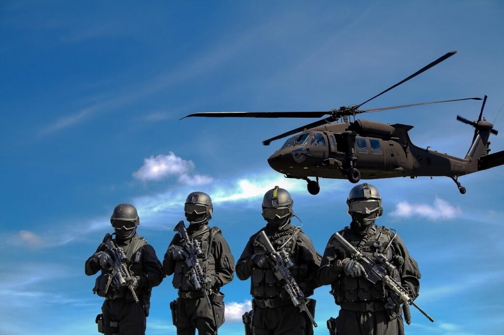 Soldiers and a helicopter, the end users behind military contracts