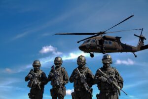 Soldiers and a helicopter, the end users behind military contracts