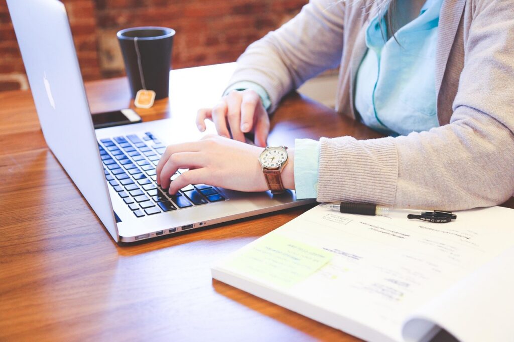 Small business owner reviewing set-aside solicitations on a laptop